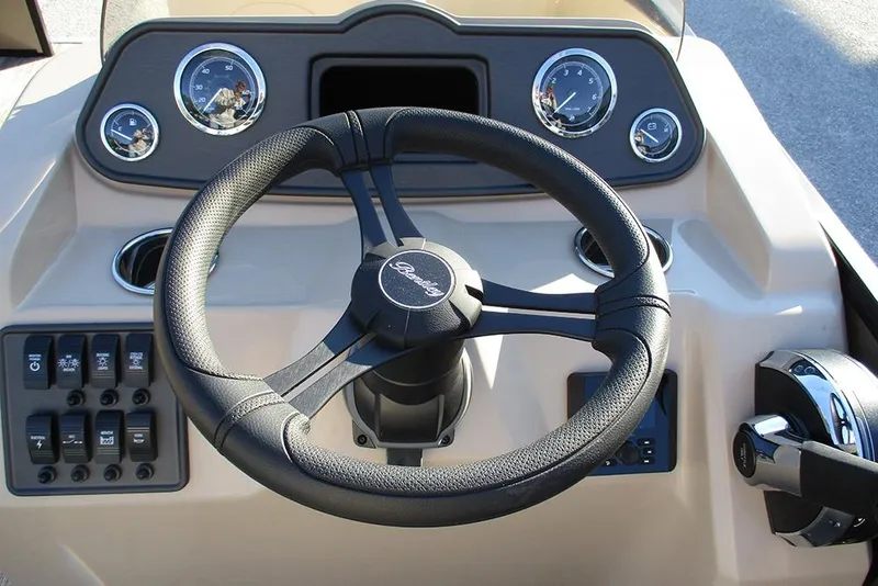 Slide: The Image of 2026 Bentley Pontoons Fish 200 4-Point steering console with gauges and controls. - 23