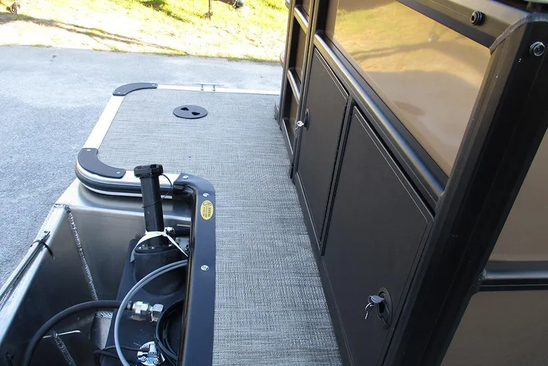 Slide: The Image of 2026 Bentley Pontoons Fish 200 4-Point deck with storage compartments and equipment. - 24