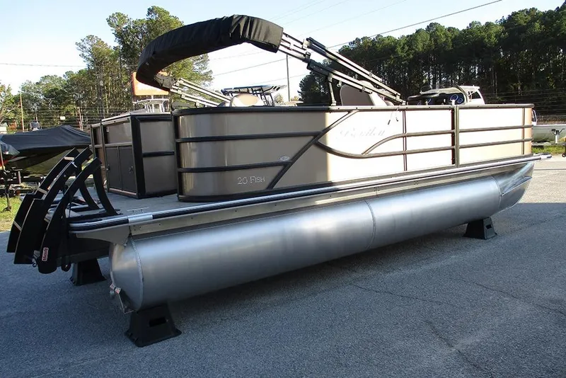 Slide: The Image of 2026 Bentley Pontoons Fish 200 4-Point pontoon boat on display outdoors. - 4