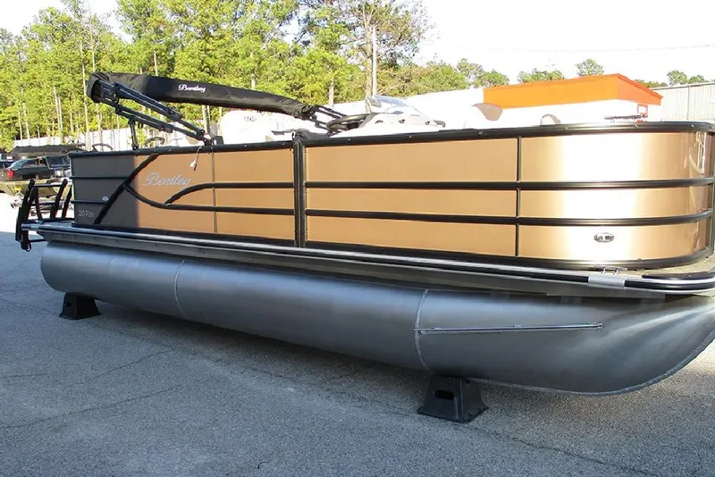 Slide: The Image of 2026 Bentley Pontoons Fish 200 4-Point pontoon boat in a parking lot. - 5