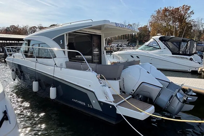 The Image of 2023 Beneteau Antares 11 boat docked, featuring sleek design and powerful outboard engines. - 0