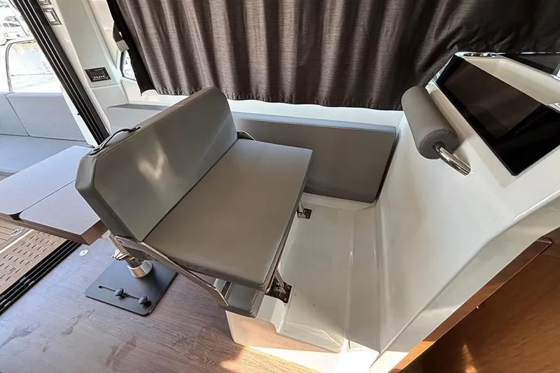 Slide: The Image of 2023 Beneteau Antares 11 interior with modern seating and sleek design. - 15