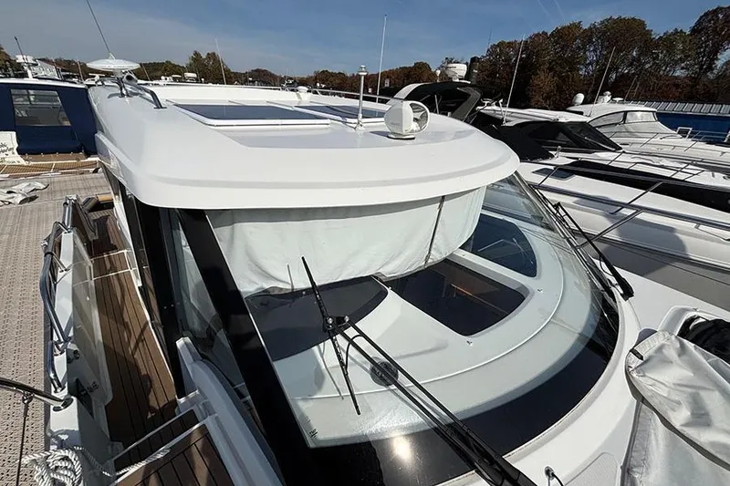 Slide: The Image of 2023 Beneteau Antares 11 yacht docked, showcasing sleek design and modern features. - 2