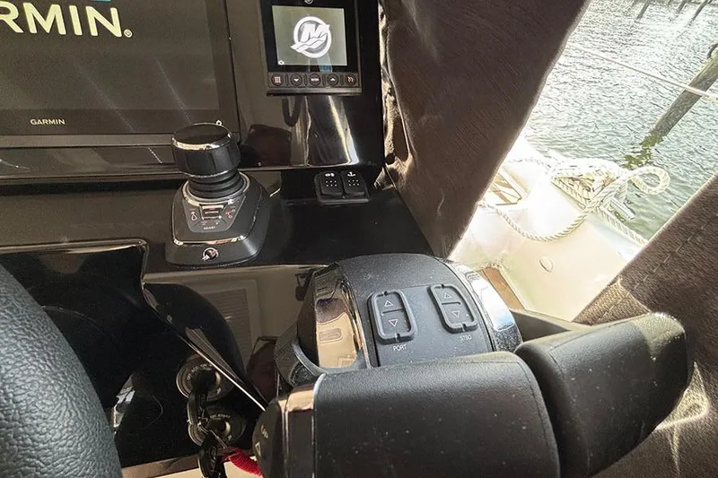 Slide: The Image of 2023 Beneteau Antares 11 helm with Garmin navigation and control systems. - 24