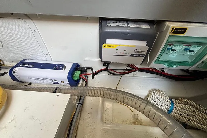 Slide: The Image of Electrical components in the engine room of a 2023 Beneteau Antares 11 boat. - 39