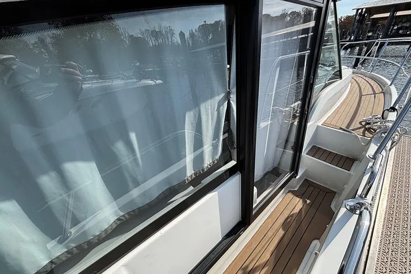 Slide: The Image of 2023 Beneteau Antares 11 yacht with sleek deck and large windows. - 6