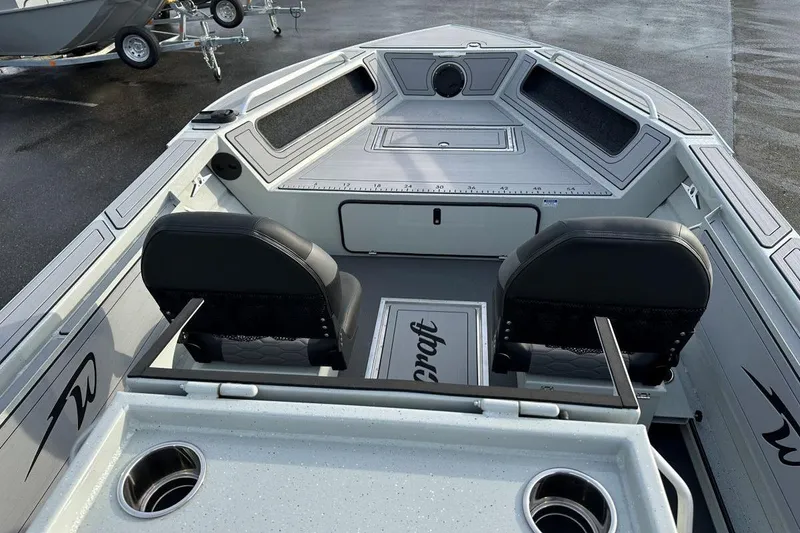 Slide: The Image of 2026 Weldcraft 200 Rebel Open CC boat interior with seating and storage compartments. - 6