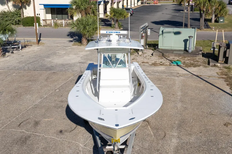 Slide: The Image of 2005 Regulator 32 Classic boat on trailer in parking lot, aerial view. - 13