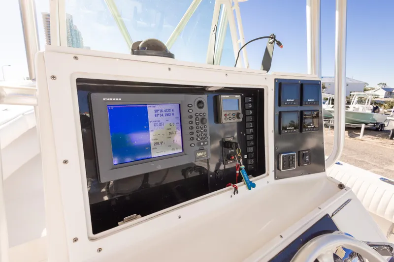 Slide: The Image of 2005 Regulator 32 Classic boat dashboard with navigation and control systems. - 20
