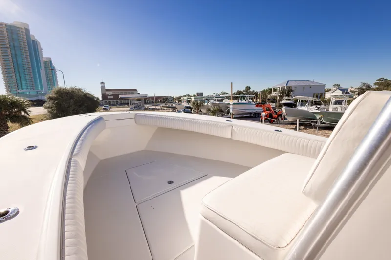 Slide: The Image of 2005 Regulator 32 Classic boat docked with urban skyline in background. - 24