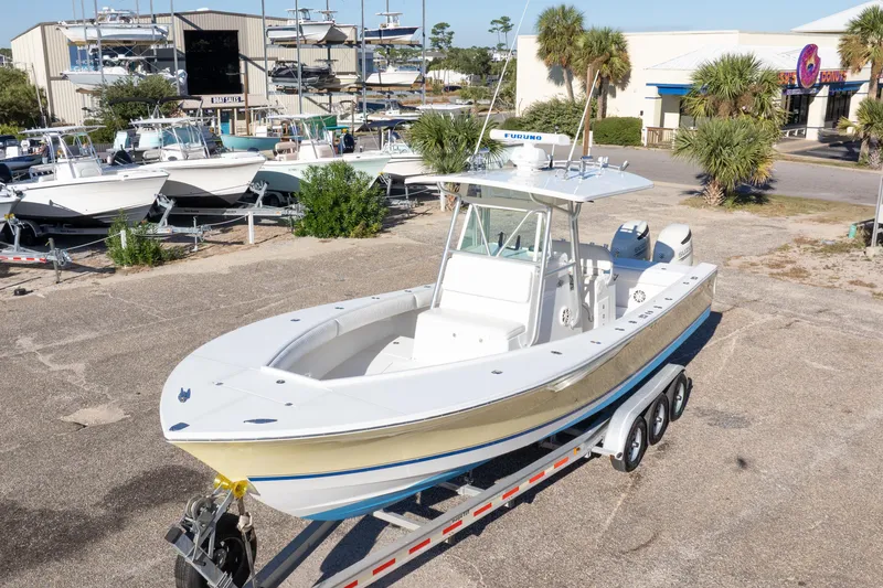 Slide: The Image of 2005 Regulator 32 Classic boat on trailer in marina setting. - 5