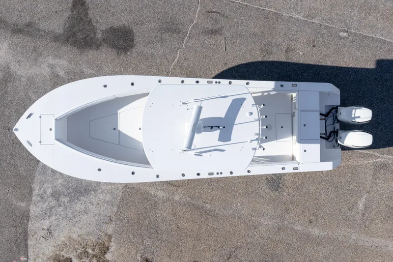 Slide: The Image of Overhead view of a 2005 Regulator 32 Classic boat on pavement. - 8