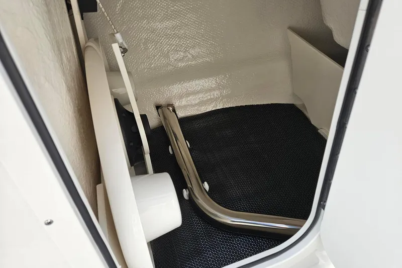 Slide: The Image of 2025 Chaparral 23 SSi boat interior storage compartment with sleek design and durable materials. - 15