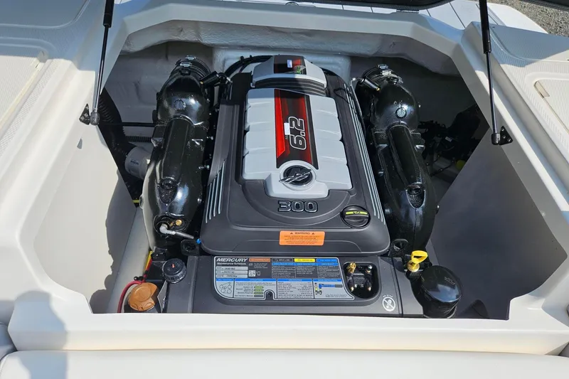 Slide: The Image of 2025 Chaparral 23 SSi boat engine compartment with Mercury 6.2L 300 HP engine. - 16