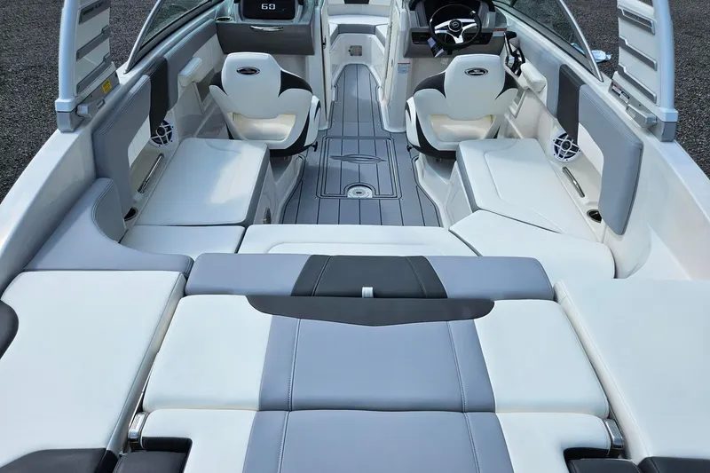 Slide: The Image of 2025 Chaparral 23 SSi boat interior with sleek seating and modern dashboard design. - 3