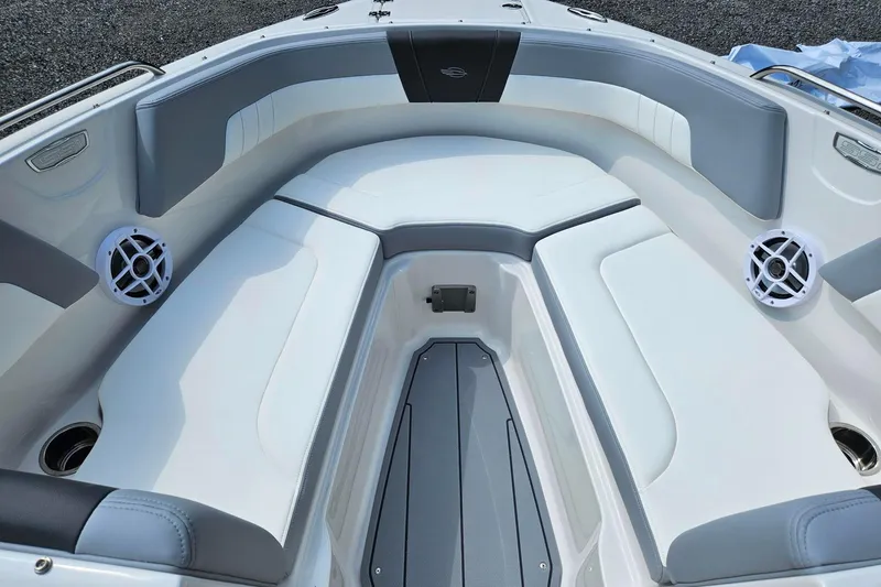 Slide: The Image of 2025 Chaparral 23 SSi boat interior with white seating and speakers. - 5