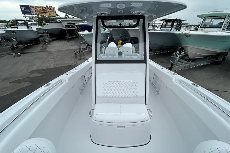 Slide: The Image of 2026 Sportsman Open 252 Center Console boat in a dealership lot. - 13