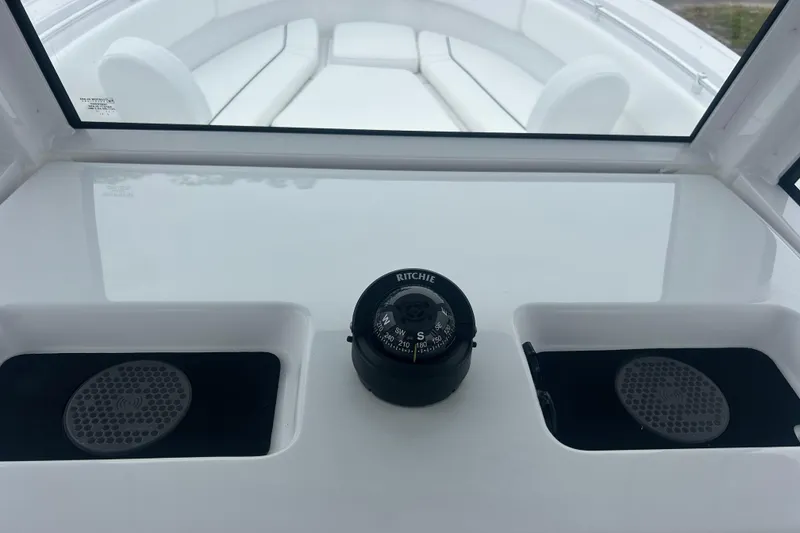 Slide: The Image of 2026 Sportsman Open 252 Center Console dashboard with compass and speakers. - 17