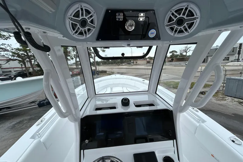 Slide: The Image of 2026 Sportsman Open 252 Center Console boat interior with advanced dashboard and speakers. - 19