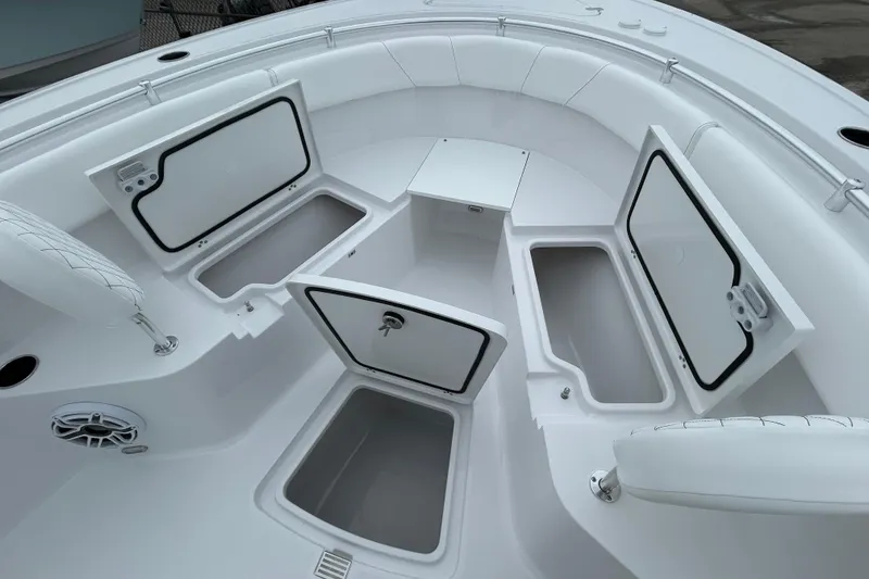 Slide: The Image of 2026 Sportsman Open 252 Center Console boat with open storage compartments. - 23