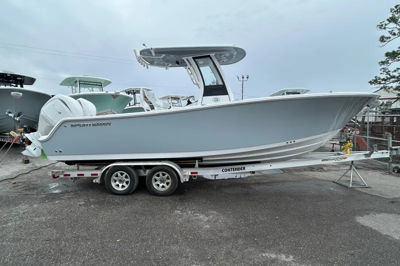 Slide: The Image of 2026 Sportsman Open 252 Center Console boat on trailer, side view. - 3