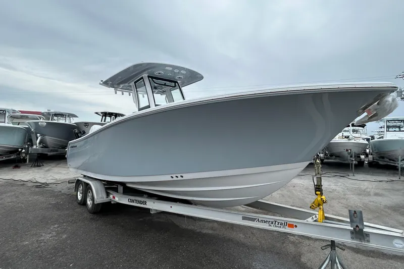 Slide: The Image of 2026 Sportsman Open 252 Center Console boat on trailer, ready for transport. - 4