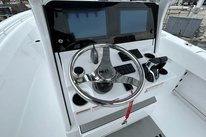 Slide: The Image of 2026 Sportsman Open 252 Center Console helm with dual screens and steering wheel. - 8
