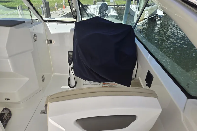 Slide: The Image of Twin Yamaha outboard engines on a 2020 Pursuit DC 266 Dual Console boat. - 15