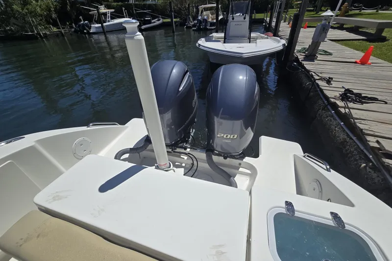 Slide: The Image of 2020 Pursuit DC 266 Dual Console with twin 200 Yamaha outboard engines. - 19