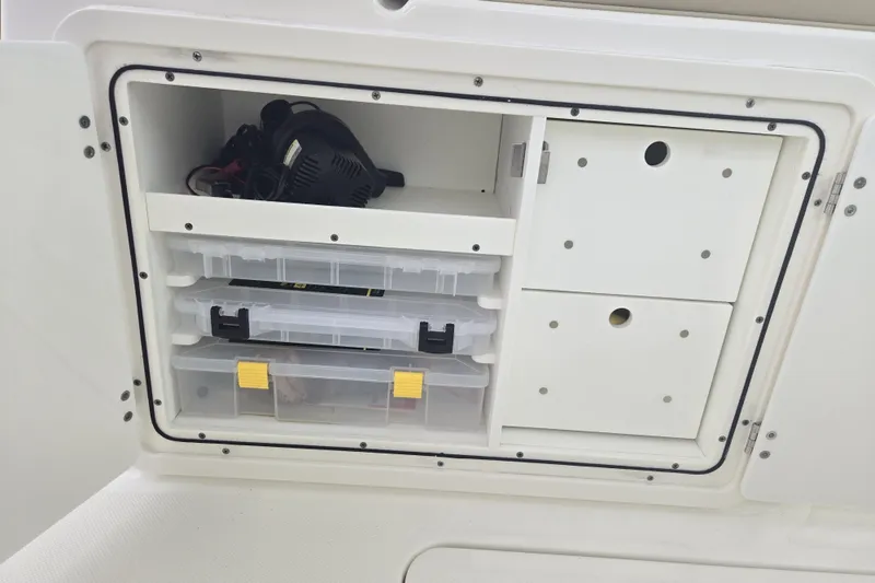 Slide: The Image of 2020 Pursuit DC 266 Dual Console boat features fresh water, battery charger, and raw water access. - 24