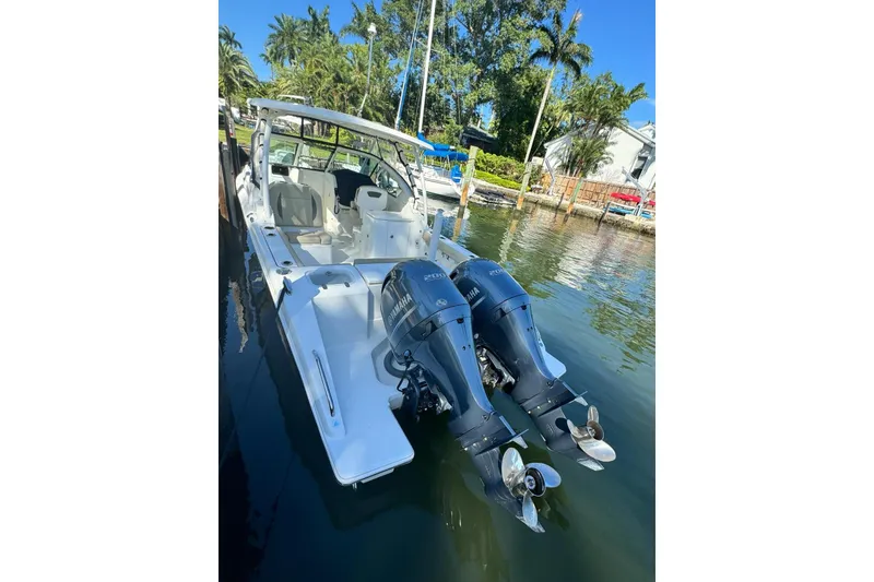 Slide: The Image of 2020 Pursuit DC 266 Dual Console boat on stand, viewed from below. - 35