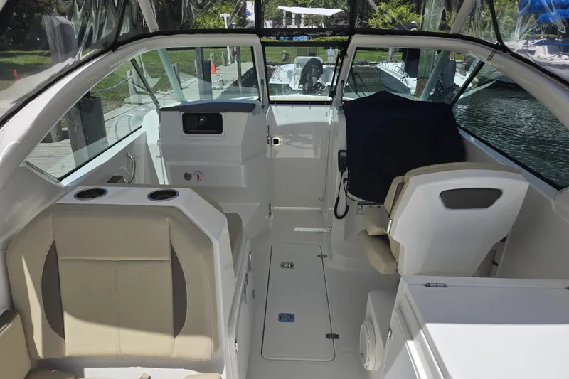 Slide: The Image of 2020 Pursuit DC 266 Dual Console boat hull on stands in a shipyard. - 41