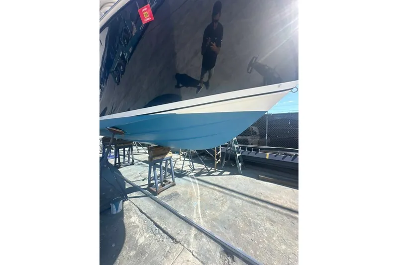 Slide: The Image of 2020 Pursuit DC 266 Dual Console boat interior with seating and helm station. - 49