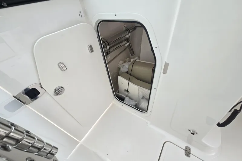 Slide: The Image of 2020 Pursuit DC 266 Dual Console boat bathroom with sink and toilet. - 7