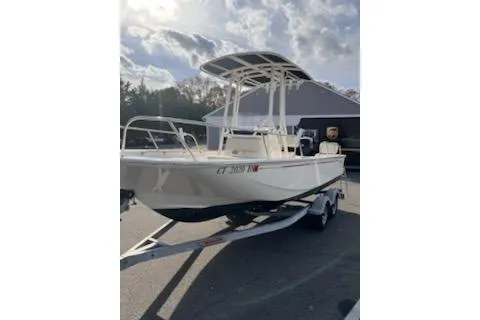 Slide: The Image of 2021 Boston Whaler 190 Montauk boat console with storage compartment open. - 10