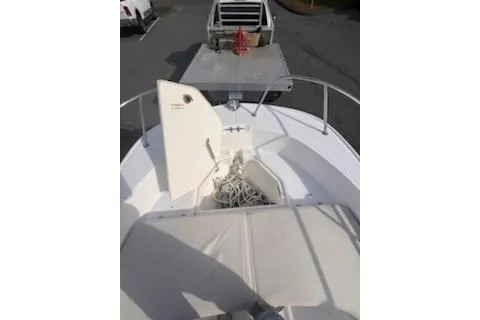 Slide: The Image of 2021 Boston Whaler 190 Montauk boat interior with steering console and seating. - 6