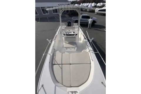 Slide: The Image of 2021 Boston Whaler 190 Montauk boat with open storage compartment and coiled rope. - 8