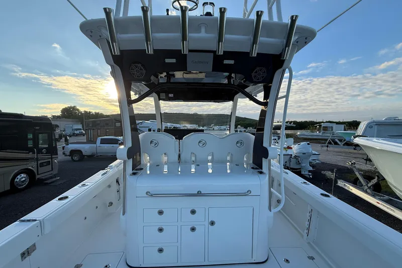 Slide: The Image of 2018 Edgewater 370CC boat interior with helm station and storage compartments. - 8