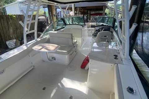 Slide: The Image of 2017 Boston Whaler 270 Vantage boat interior with seating and helm. - 10