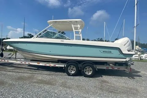 Slide: The Image of 2017 Boston Whaler 270 Vantage boat on trailer, parked outdoors. - 2