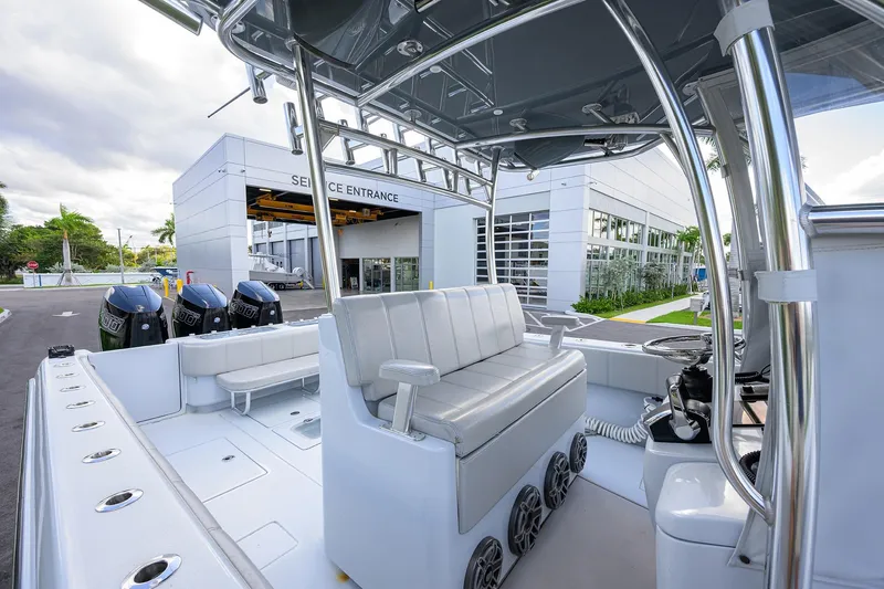 Slide: The Image of 2022 Contender 39 ST boat with triple engines at service entrance. - 13