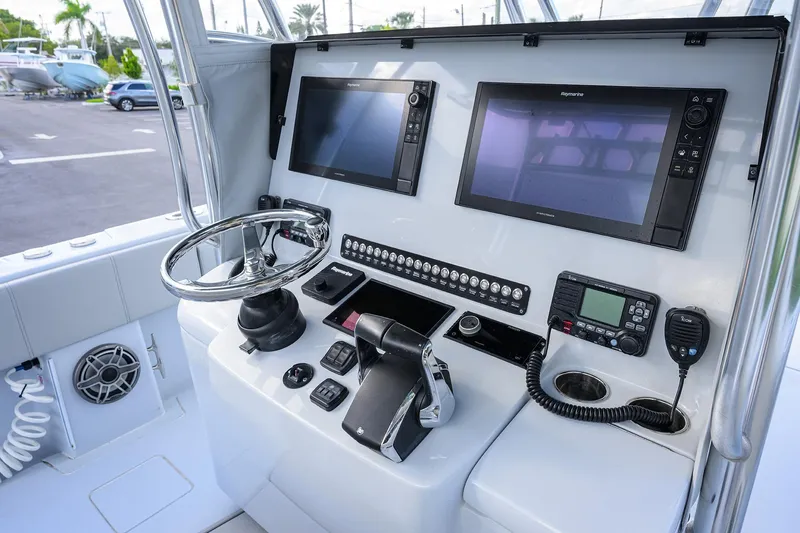 Slide: The Image of 2022 Contender 39 ST boat helm with advanced navigation and control systems. - 4