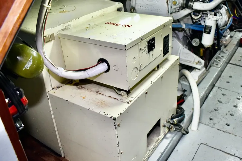 Slide: The Image of Engine room of 1987 Californian 55 Cockpit Motor Yacht with visible machinery and wiring. - 10