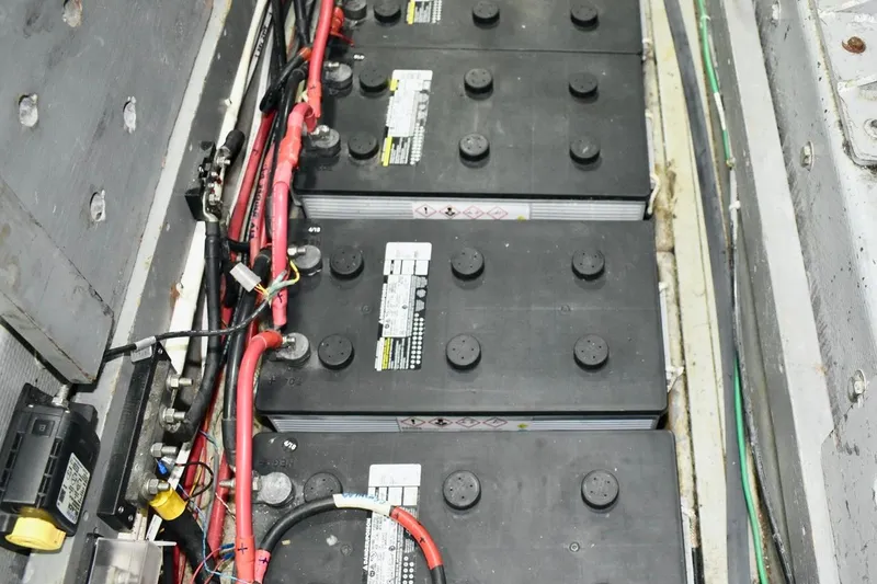 Slide: The Image of Battery compartment of 1987 Californian 55 Cockpit Motor Yacht with wiring and connections. - 12