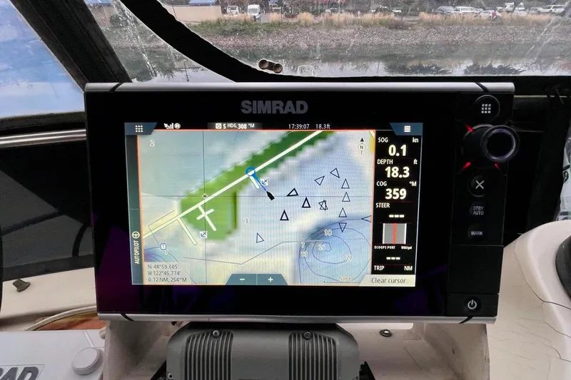 Slide: The Image of Simrad navigation display on 1987 Californian 55 Cockpit Motor Yacht, showing nautical chart and data. - 38