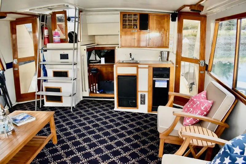 Slide: The Image of Interior of 1987 Californian 55 Cockpit Motor Yacht with cozy seating and nautical decor. - 4