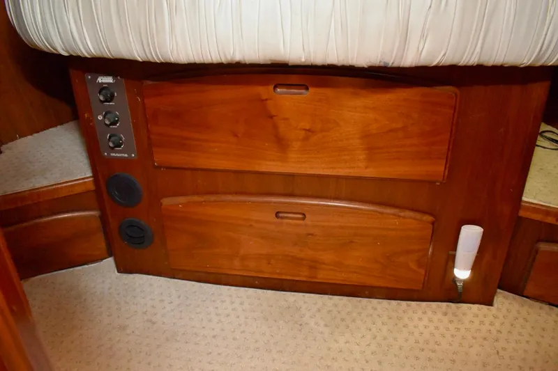 Slide: The Image of 1987 Californian 55 Cockpit Motor Yacht interior with wooden cabinetry and control panel. - 47