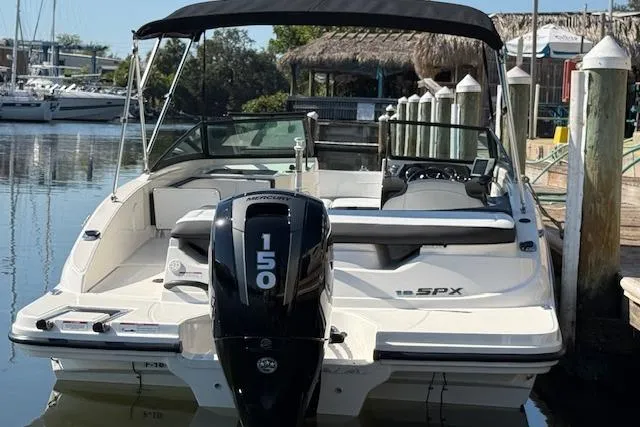 Slide: The Image of 2017 Sea Ray SPX 190 Outboard boat docked, featuring a 150 HP engine. - 13