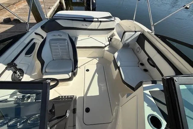 Slide: The Image of 2017 Sea Ray SPX 190 Outboard boat interior with seating and steering wheel. - 17