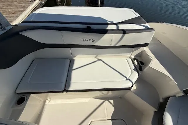 Slide: The Image of 2017 Sea Ray SPX 190 Outboard boat interior with cushioned seating and sleek design. - 18